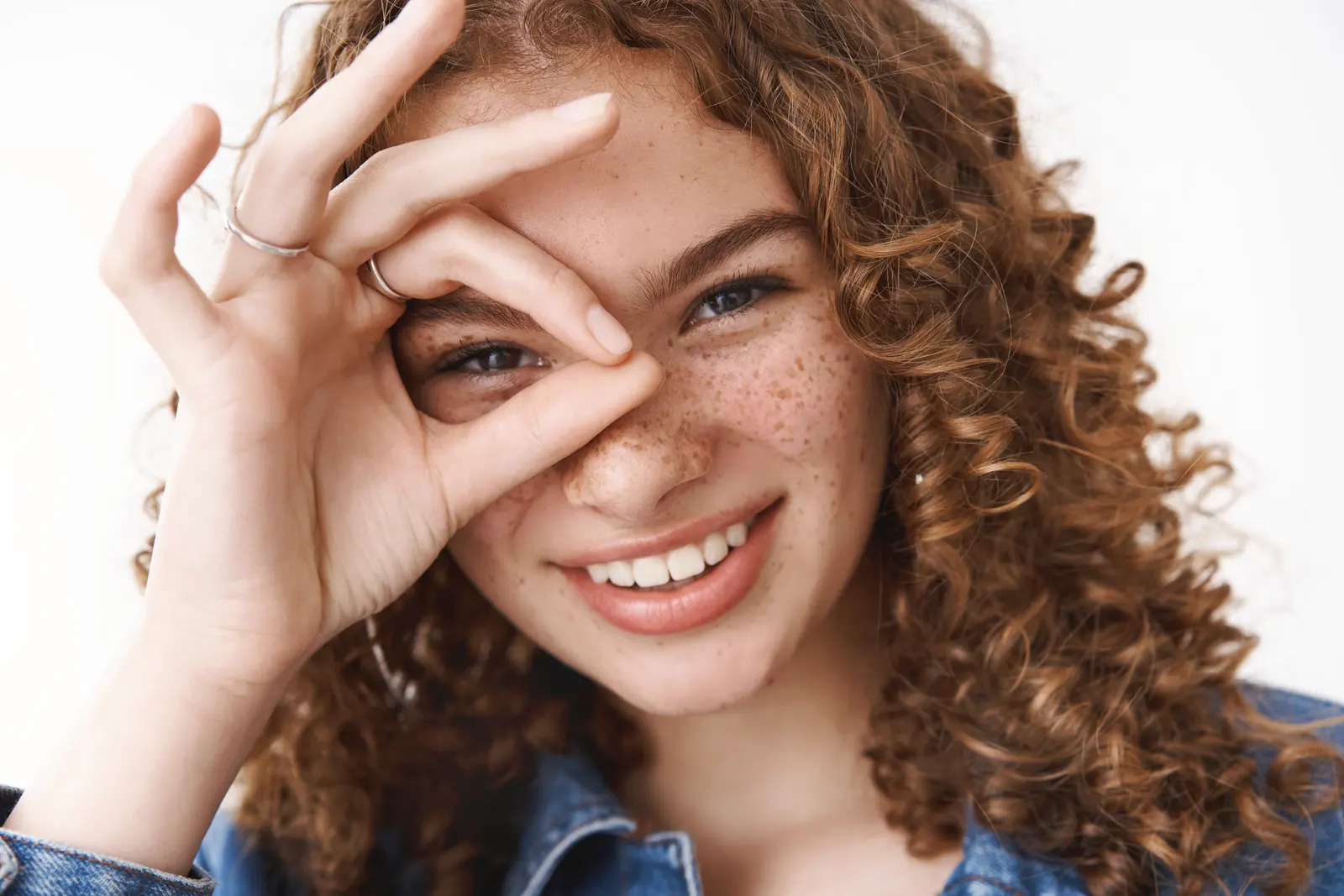A smiling shopper making an OK sign